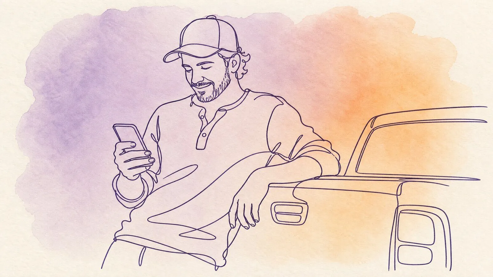 A man leaning on the tailgate of his pickup, looking at his phone with a half-smile